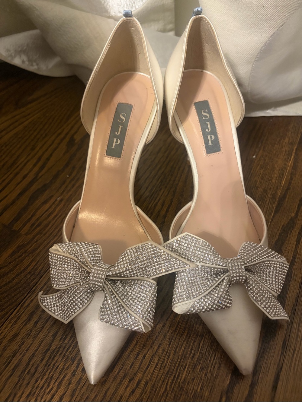 SJP by Sarah Jessica Parker Ivory Satin Pointed-Toe Pumps with Crystal Bow